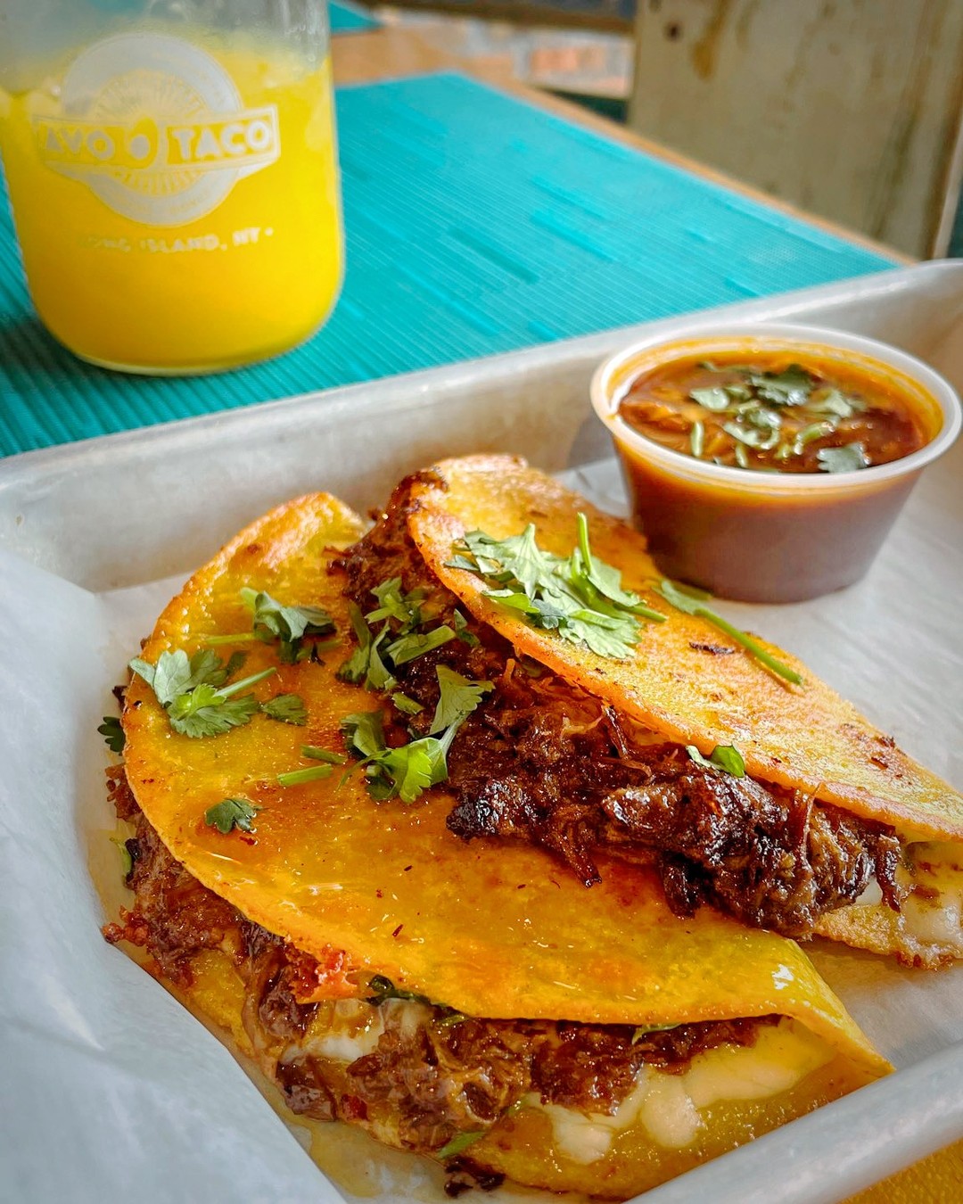 Need to brighten your day? Our Dos Birria Tacos are on the menu and packed with flavor! We slow roast our beef, then grill the tortilla, which gets topped with jack cheese and until melted. It all comes together beautifully, then it gets topped with cilantro. Served with a rich consommé and paired with one of our fresh squeezed cocktails, you'll be singing its praises to everyone you know.
#birria #birriatacos #tacos #lifoodie #foodexperience #gardencityny #newhydepark #nyeats #queensfoodie #nassaucounty  #foodscene #tacoparty #tacosarelife #beeftacos 
Available in New Hyde Park only. Not available on Tuesdays.