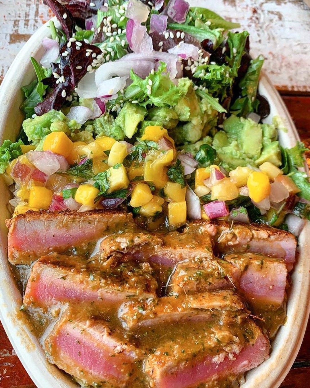 What are you eating for lunch today? 😋
Our Tuna Montezuma Bowl at AVO TACO is a must try! Made with seared ahi tuna, mango salsa, red onion, avocado, sesame seeds, and dressed with ginger soy vinaigrette. You can't go wrong with a Avo Bowl and signature cocktail for a mid-week pick me up. 🥑🌮❤

 #longislandny #longisland #longislandfoodies #longislandfoodie #lifoodie #newhydepark #newhydeparkny #longislandrestaurants #lifoodfinds #tacos #bowls #tunabowl #newyorkfood #newyorkfoodie
